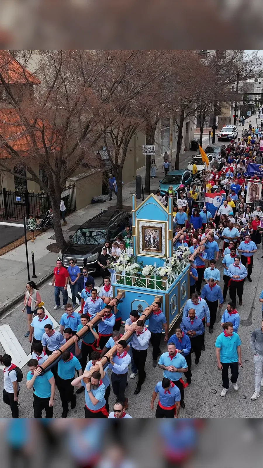 Overhead view of the March for Life procession carrying the restored processional vada through downtown Tampa